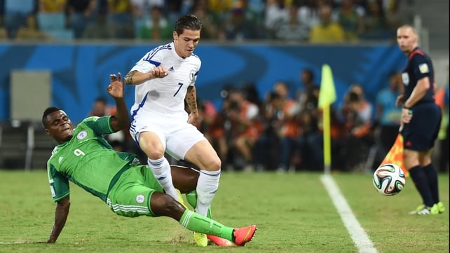 Emmanuel Emenike fights for the ball with Bosnia-Hercegovina's defender Muhamed Besic