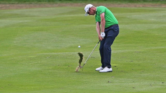 Mikko Ilonen raises a divot on day three
