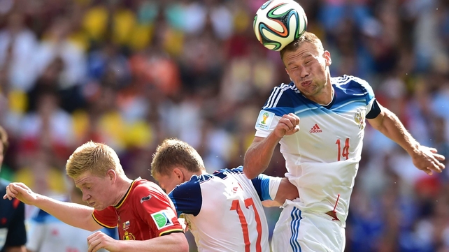 ... which saw play continuing at the same lacklustre level as before. Here, Russia defender Vasily Berezutskiy clears the ball away after a drab Belgium attack