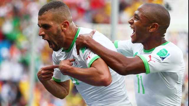 Slimani (L) celebrated creating the early lead