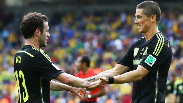 The match - and the 2014 World Cup - ended for Spain on a bright note, as Torres (R) and substitute forward Juan Mata (L) each scored goals to bring the final score to 3-0. Spain will go home knowing that at least they finished ahead of the Aussies