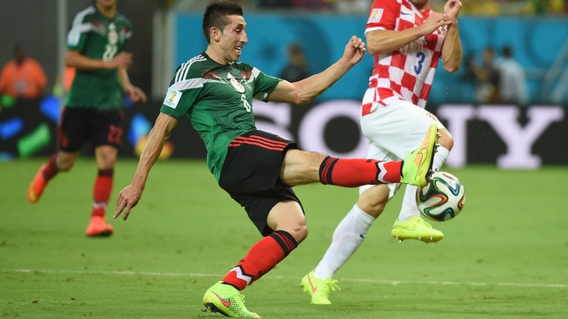 Mexico midfielder Hector Herrera worked against Croatia defender Danijel Pranjic