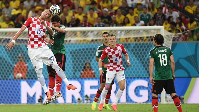Croatia forward Mario Mandzukic tried to create some motion with a header against Mexico defender Hector Moreno