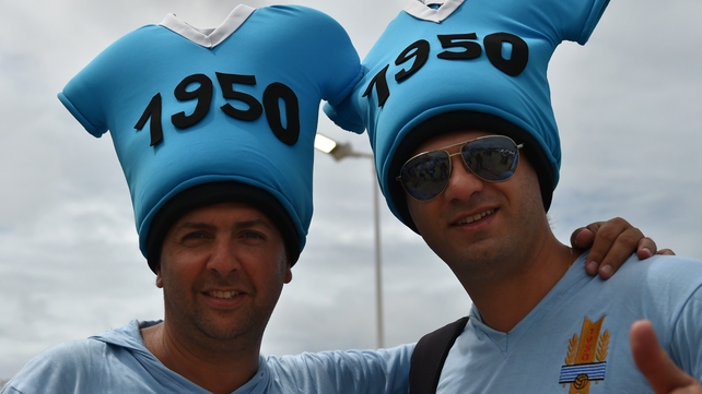 Uruguayan fans pose outside the Dunas Arena
