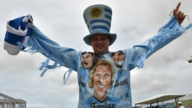 A Uruguay fan poses outside the Dunas Arena prior to a Group D football match between Italy and Uruguay in Natal