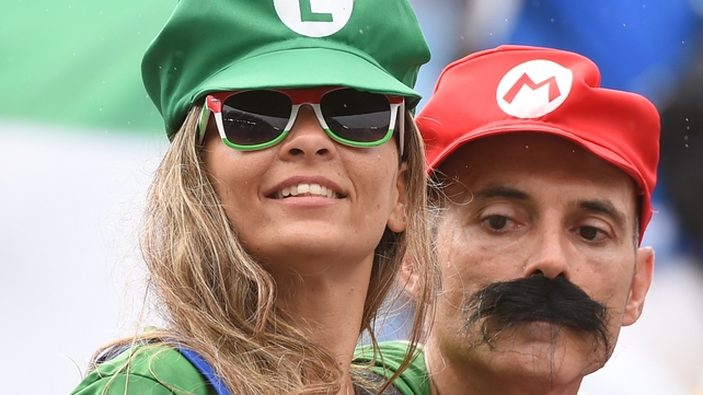 Italy fans show their support for Mario Balotelli by dressing up as Super Mario and Luigi prior to Italy v Uruguay