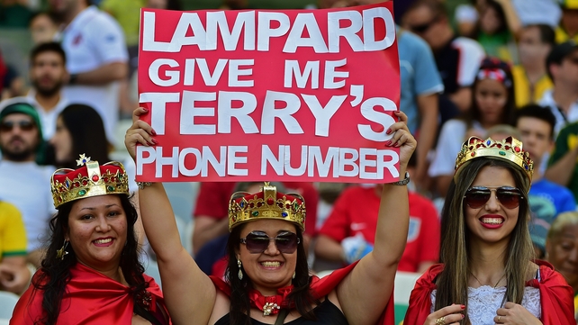 Fans hold up a poster before the start of Costa Rica vs England at the Mineirao Stadium in Belo Horizonte