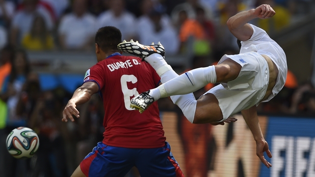 England defender Gary Cahill takes flight amid a challenge from Costa Rica's defender Oscar Duarte