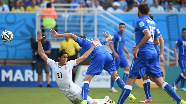 Uruguay forward Edinson Cavani appeals that he has been fouled by Italy's Leonardo Bonucci