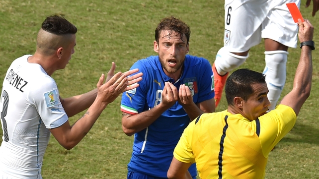 Italy's midfielder Claudio Marchisio reacts as he is shown a red card by Mexican referee Marco Antonio Rodriguez Moreno