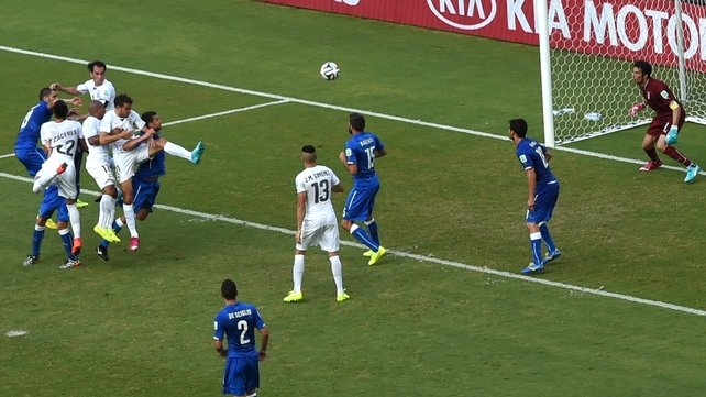Diego Godin leaps to score for Uruguay against Italy