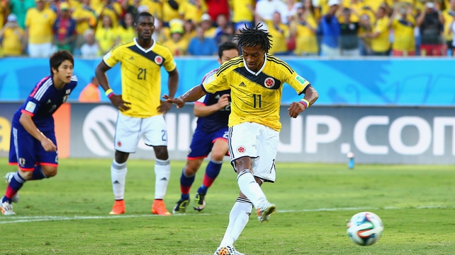 Colombia's opening goal in stages: Juan Guillermo Cuadrado calmly slots the ball...