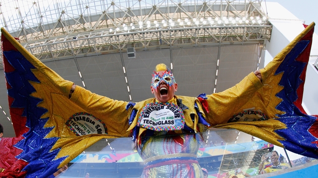A Colombian fan shows how it should be done as he watches his team take on Japan