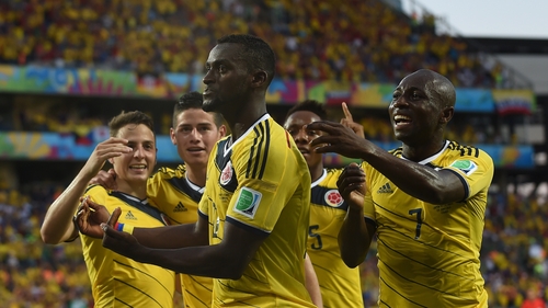 Jackson Martinez celebrates with team-mates as Colombia topped Group C