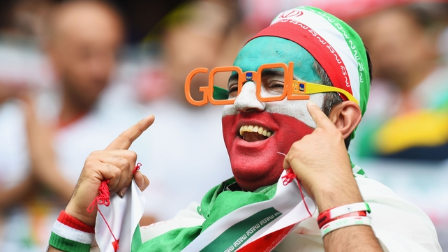 An Iranian fan shows an eye for goal (but seems to spell it wrongly, which kind of ruins the pun)