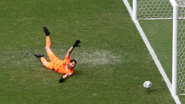 In the Group's other game, Alireza Haghigh can do little to stop Edin Dzeko's opening goal