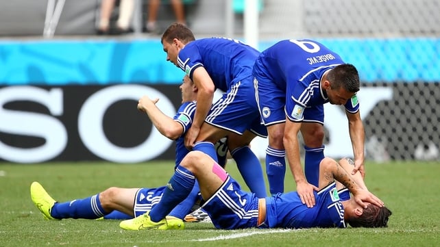 Muhamed Besic and Toni Sunjic are assisted by team-mates after a clash
