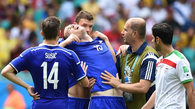Edin Dzeko supports Toni Sunjic afterwards