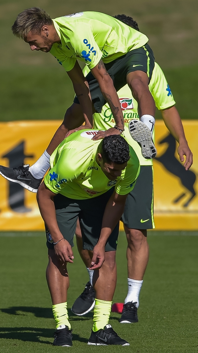 At the same training session, Neymar was in high spirits, leap-frogging Hulkl