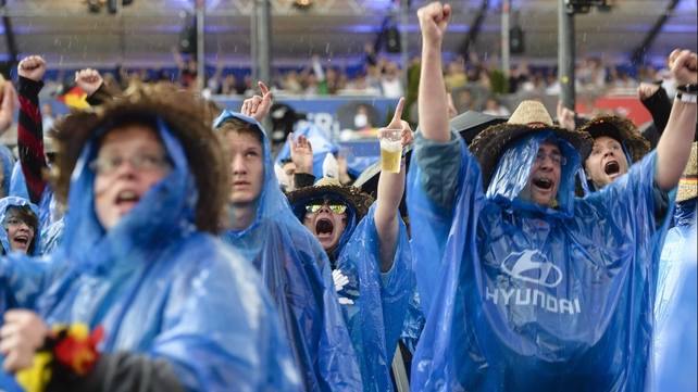 And by the end of it, soggy German fans celebrated their team's 1-0 victory and their topping of Group G