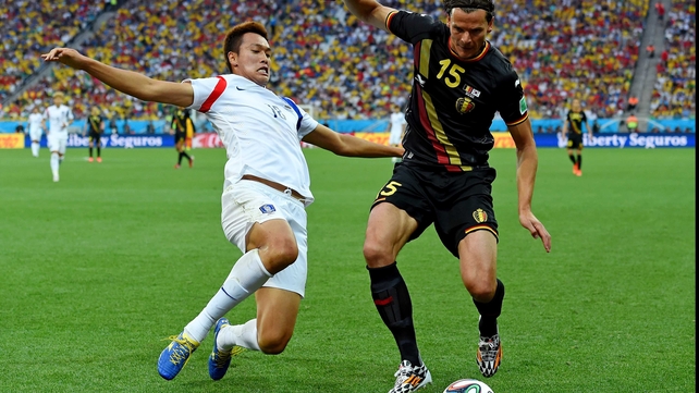 And South Korea forward Kim Shin-Wook challenged Belgium defender Daniel Van Buyten