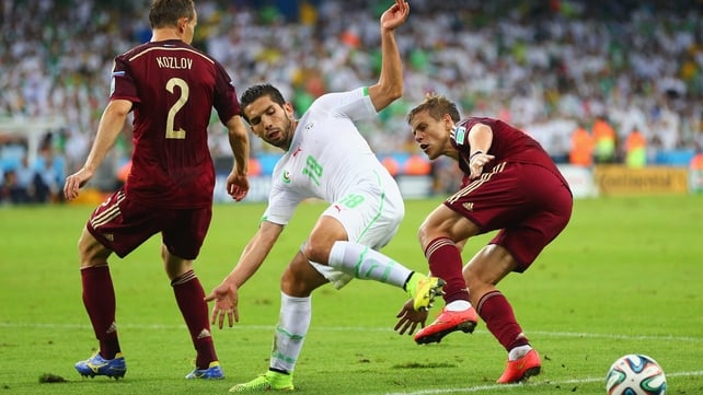 The Algerians twisted into all sorts of shapes on their quest to even things. Here, forward Abdelmoumene Djabou became a starfish, let's say