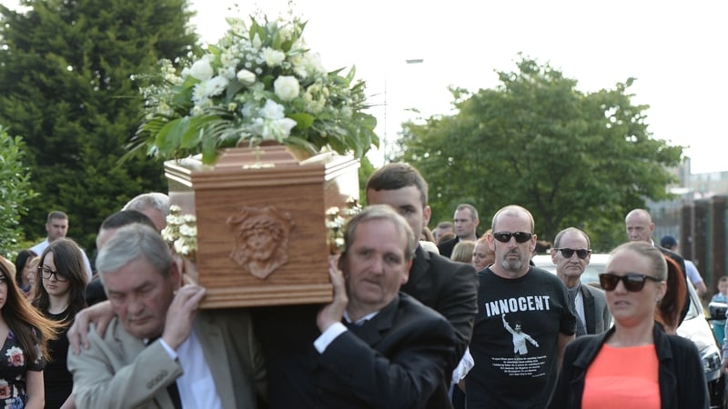 Mourners carry the coffin ahead of the funeral
