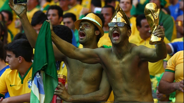 Some camouflaged Brazil supporters cheered on their side as things got underway once more