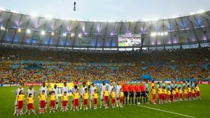 And both teams lined up to sing their anthems with gusto under the bright lights