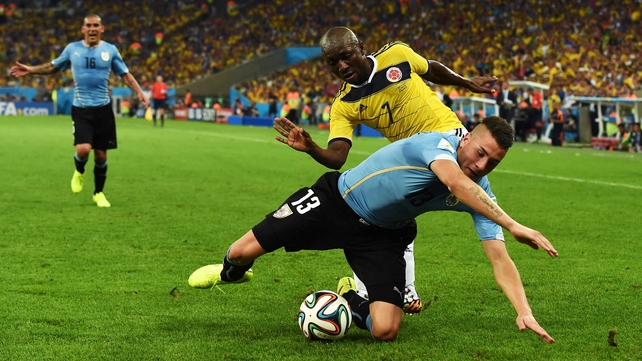 Uruguay defender Jose Gimenez and Colombia defender Pablo Armero battled it out for the ball, trying to allow both of their sides to create some more chances
