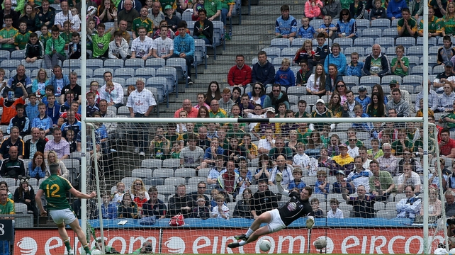 Meath's Andy Tormey scores a penalty past Kildare goalkeeper Mark Donnellan