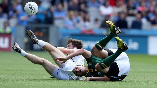 Kildare's Niall Kelly with Kevin Reilly of Meath took a tumble, meanwhile