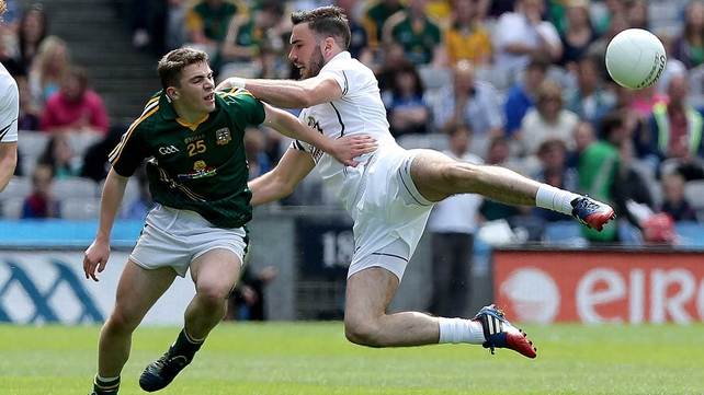 Back in Croker, Kildare's Fergal Conway took to the air in tackling Sean Curran of Meath