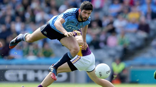 Cian O'Sullivan of Dublin leap-frogs Graeme Molloy of Wexford
