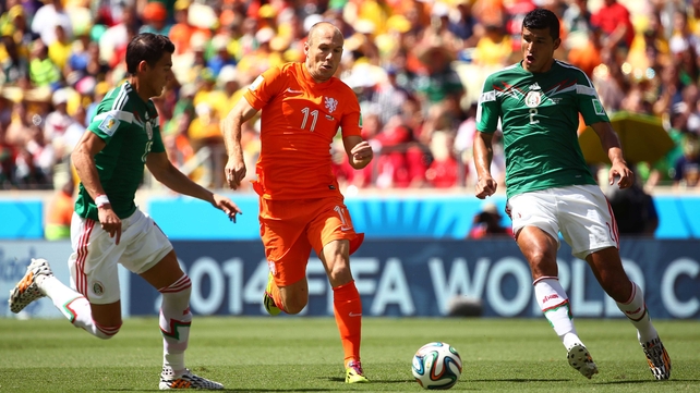 While defenders Hector Moreno and Francisco Rodriguez worked to keep Netherlands star forward Arjen Robben from sneaking a chance early on