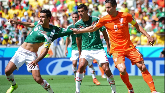 Looking heavy on their feet, Netherlands striker and captain Robin van Persie decided the best way to help his side would be to grab the shirt of Mexico defender and captain Rafael Marquez
