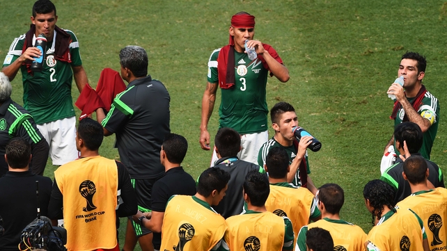 And at 32' the referees called for the first official cooling break of this World Cup. Mexico players used special red towels to cool off on the sidelines