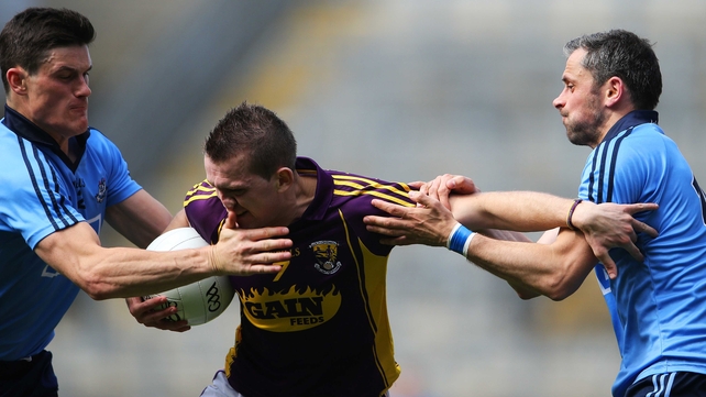 Dublin's tackling was ferocious: Here Wexford's Adrian Flynn comes under under pressure from Diarmuid Connolly and Alan Brogan