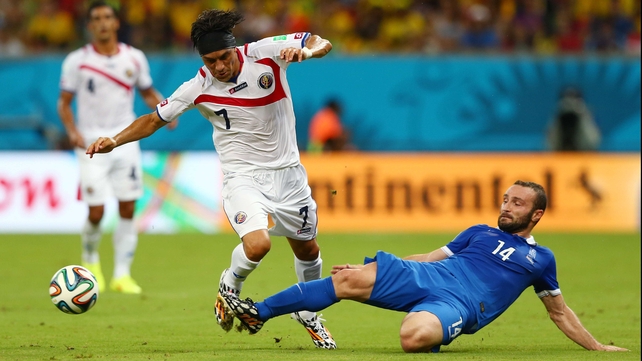 Greece forward Dimitris Salpingidis battled it out with Costa Rica midfielder Christian Bolanos in a rare trip up the pitch