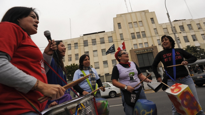 Women shout slogans during a pro-abortion protest in front of the Health Ministry in Lima