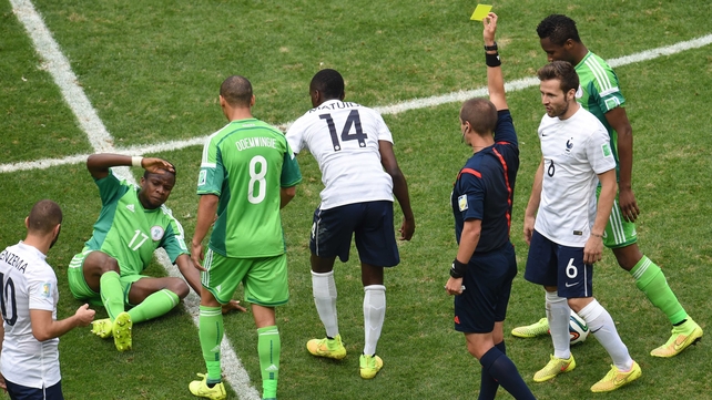 Geiger awarded the match's first yellow card - which should have been a red - to France midfielder Blaise Matuidi (#14) for a vicious ankle tackle made on Nigeria midfielder Ogenyi Onazi