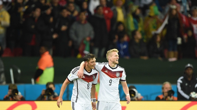 Ozil and Schuerrle joined together in a bit of revelry - almost a bit to quickly