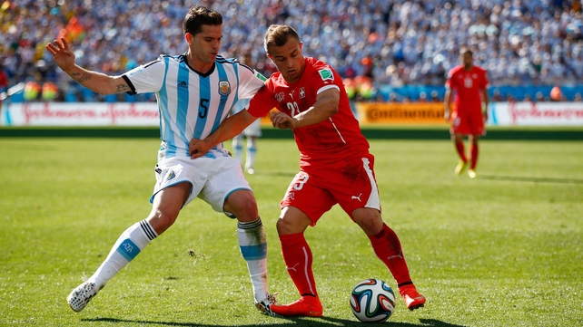 Argentina midfielder Fernando Gago and Shaqiri continued to battle it out throughout regular time