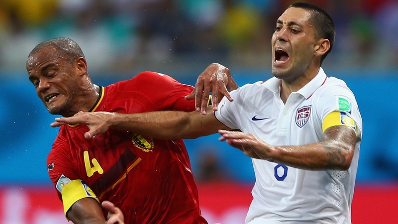 Vincent Kompany and USA's Clint Clint Dempsey clash during Belgium's extra-time win in Salvador