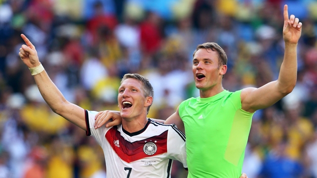 Bastian Schweinsteiger and Manuel Neuer (R) celebrate