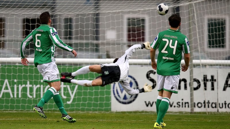Bray goalkeeper Stephen McGuinness is powerless to stop Gavin Holahan's shot