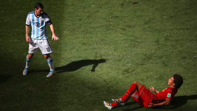 Argentina's Lionel Messi played masterfully in the first half, forcing Belgium midfielder Axel Witsel to earn his pay-check covering the star