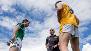 Limerick’s Seánie Buckley and Niall McKeever of Antrim at the coin toss with referee Martin Higgins in Saturday's first game