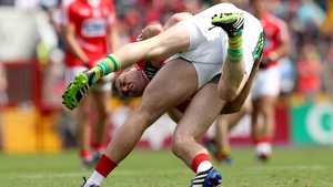 It was a tough, bruising encounter - here Kerry's Paul Murphy and Paul Kerrigan of Cork clashed off the ball