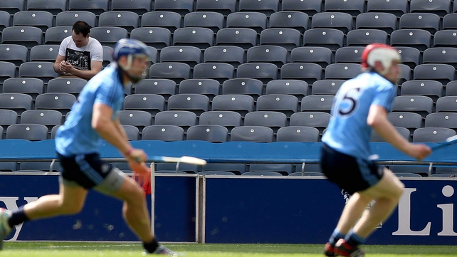This man in the crowd seemed more interested in his phone than the game